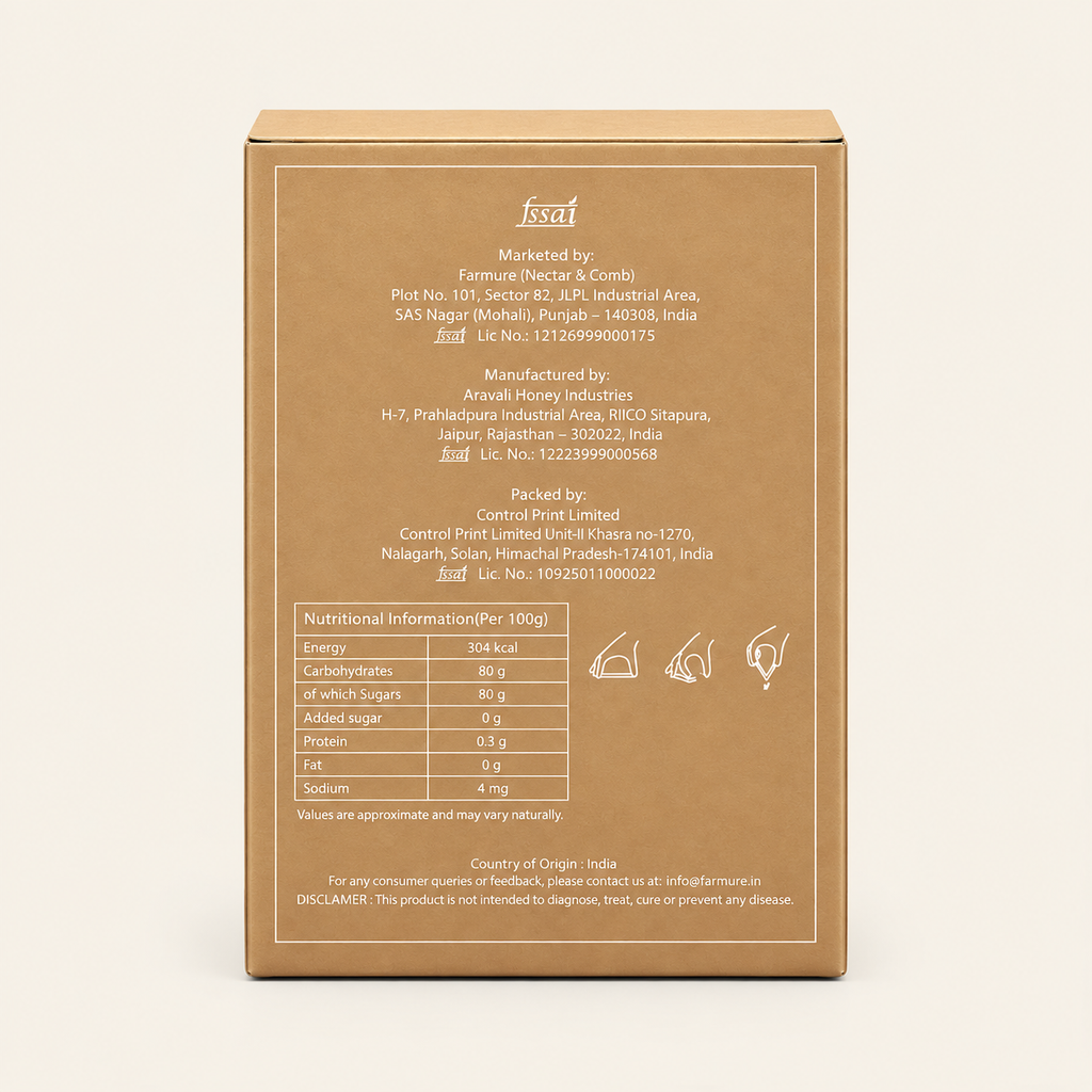 The back of a kraft paper box with printed product details, a nutrition facts table, and small icons, photographed against a plain light beige background.