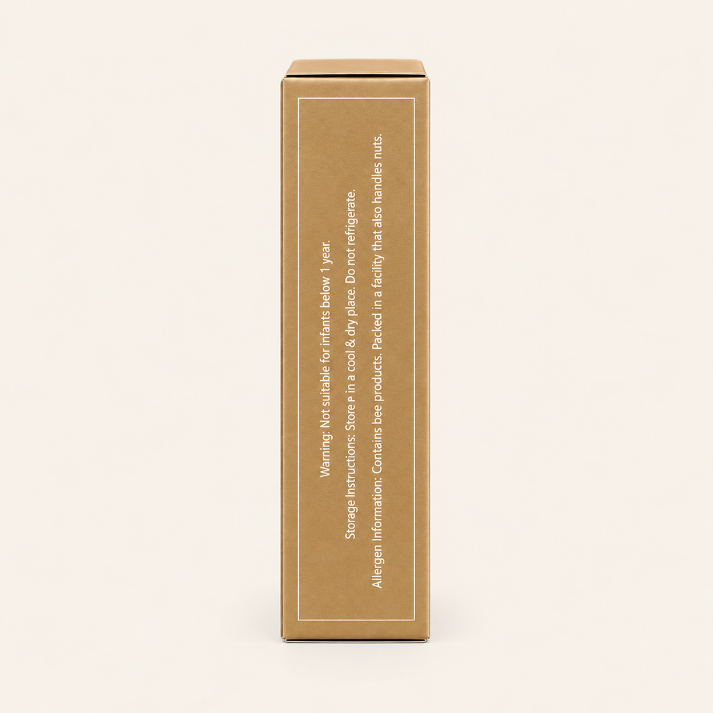 A tall, plain brown cardboard box shown upright against a warm off-white background. The front has a thin white border and small vertical text with a warning label.