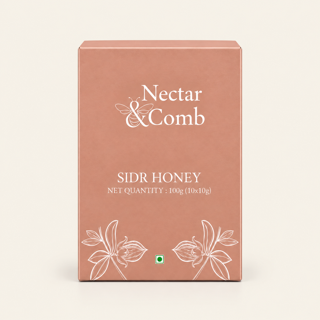 A rectangular dusty rose cardboard box for Nectar & Comb Sidr Honey, featuring white text and floral line drawings on a light cream background.