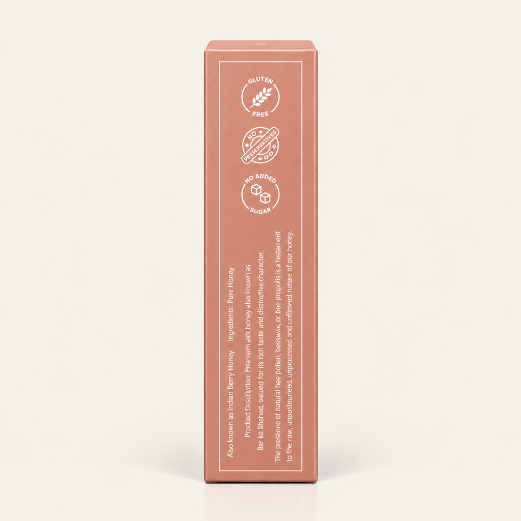 A tall, rectangular product box in a muted dusty rose color, standing upright against a light cream background. The front of the box features white icons indicating 'Gluten Free', 'Sugar Free', and 'No Artificial Sugar', along with descriptive text.